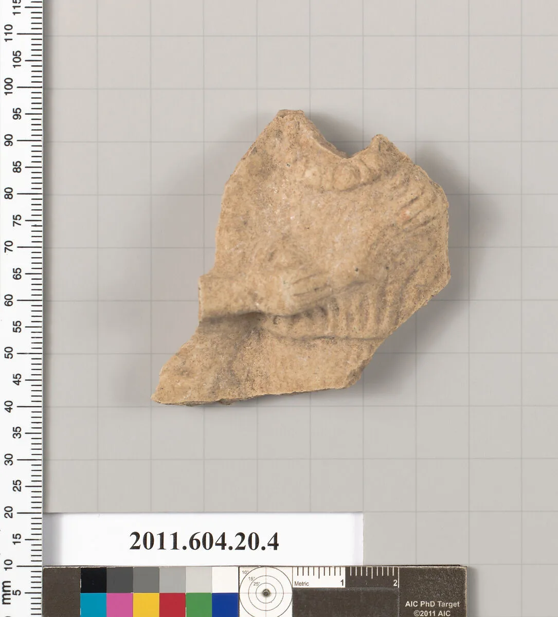 Fragment of a statuette of a woman — Unknown