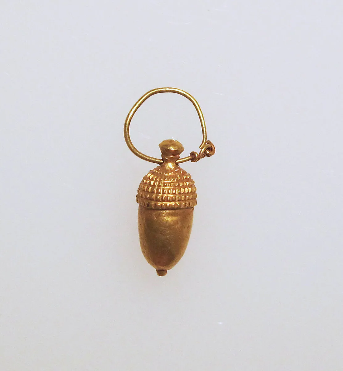 Earring with acorn pendant — Unknown