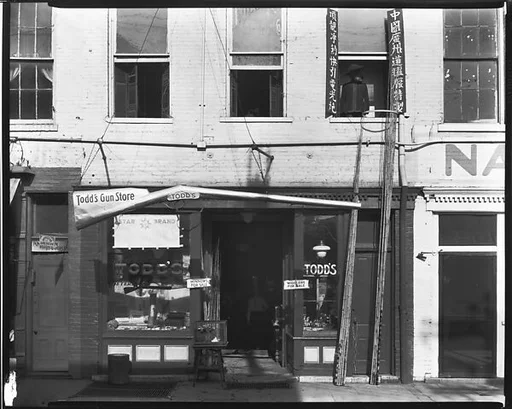 [Todd's Gun Store with Second Floor Chinese Laundry]