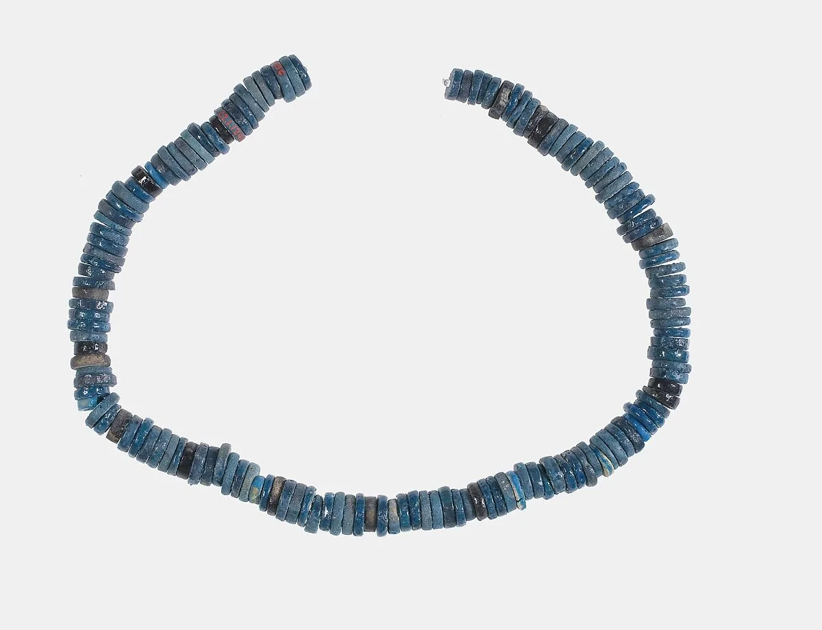 Ring beads on original string — Unknown
