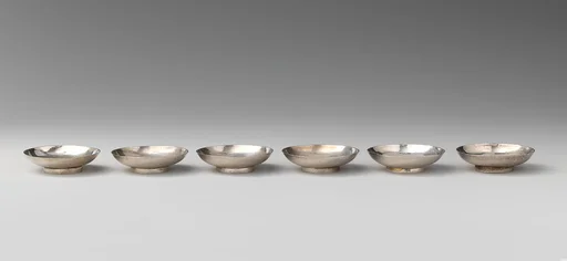Set of six miniature saucers