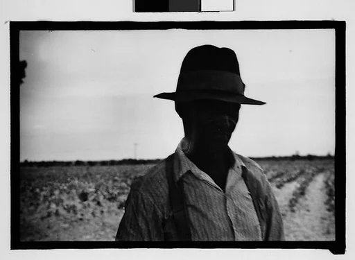 [Man Wearing Hat and Suspenders with Field in Background, Hale County?, Alabama]