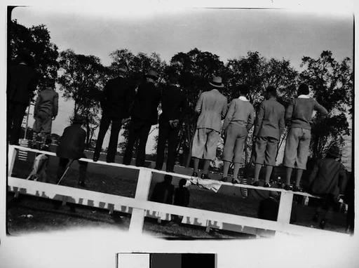 [Spectators Standing and Sitting on Wooden Fence, From Behind, Darien, Connecticut]
