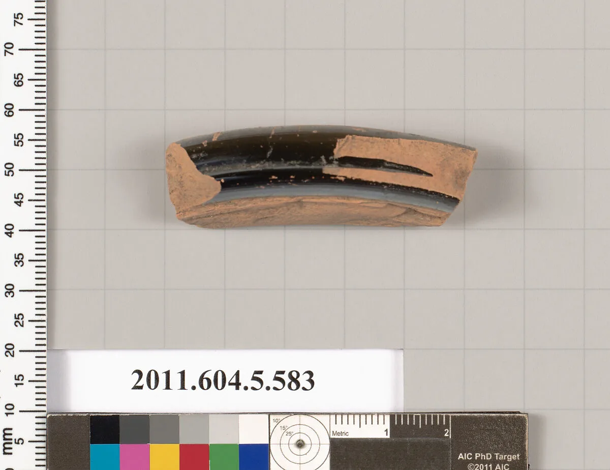 Terracotta fragment of a stemless kylix (drinking cup)? — Unknown