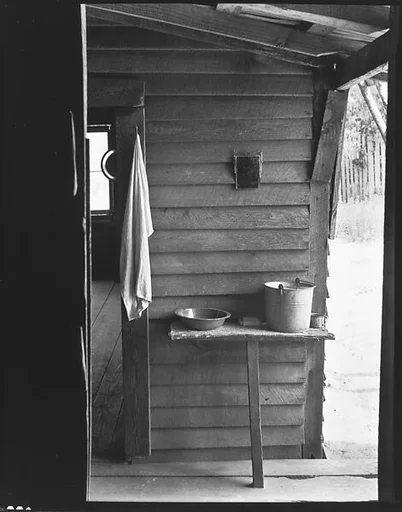 [Washstand with Pail, Bowl, and Mirror in Dog Run of Burroughs Home, Hale County, Alabama]