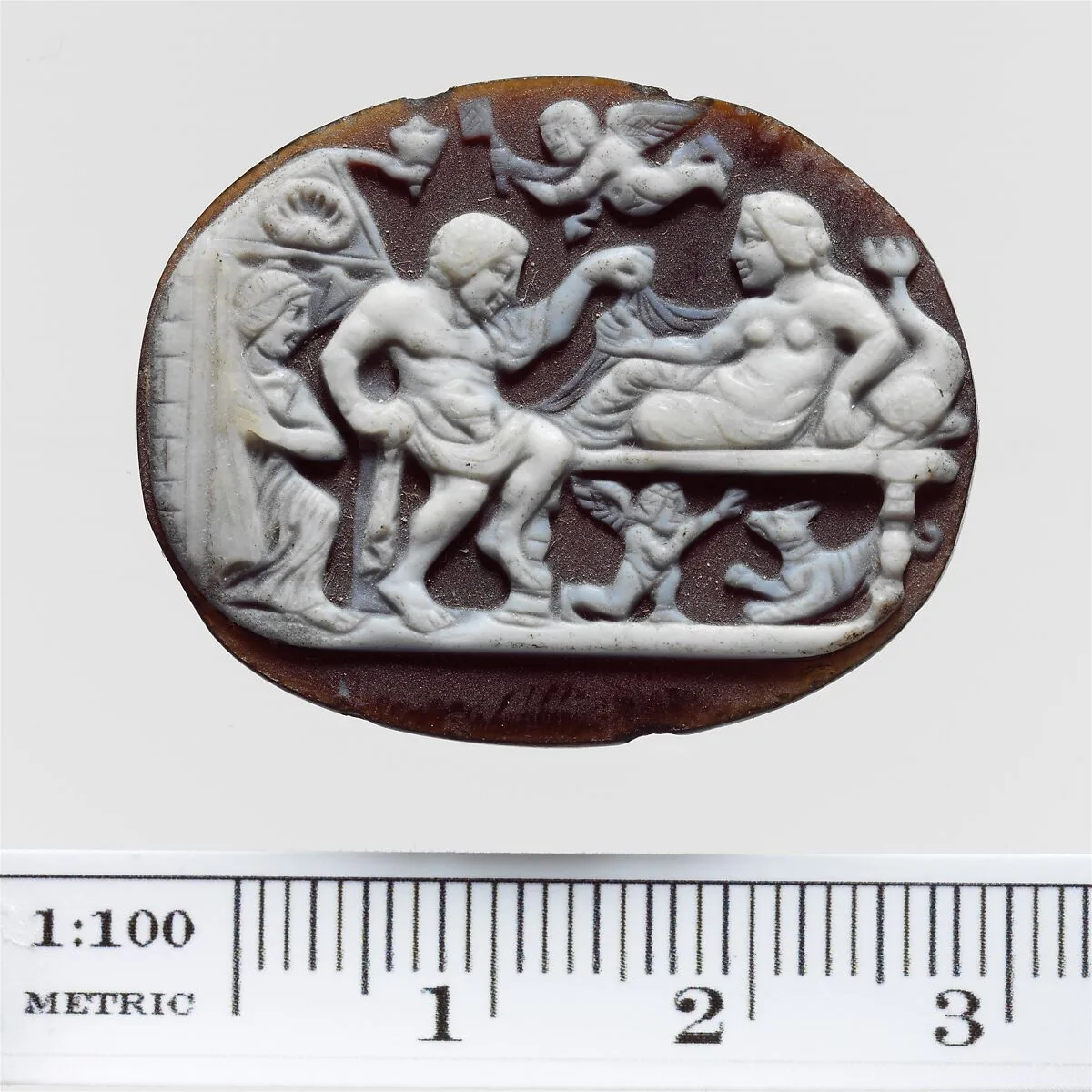 Sardonyx cameo with a man and woman on a couch — Unknown