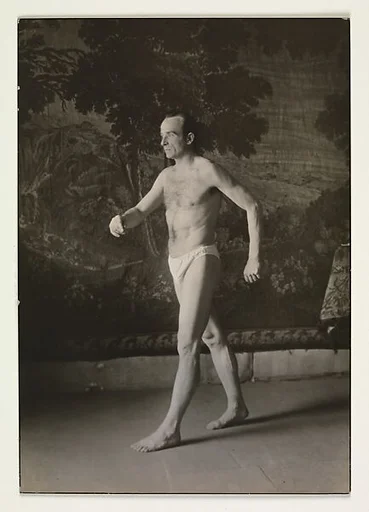 [Man in Briefs, Walking before Tapestry, Germany]