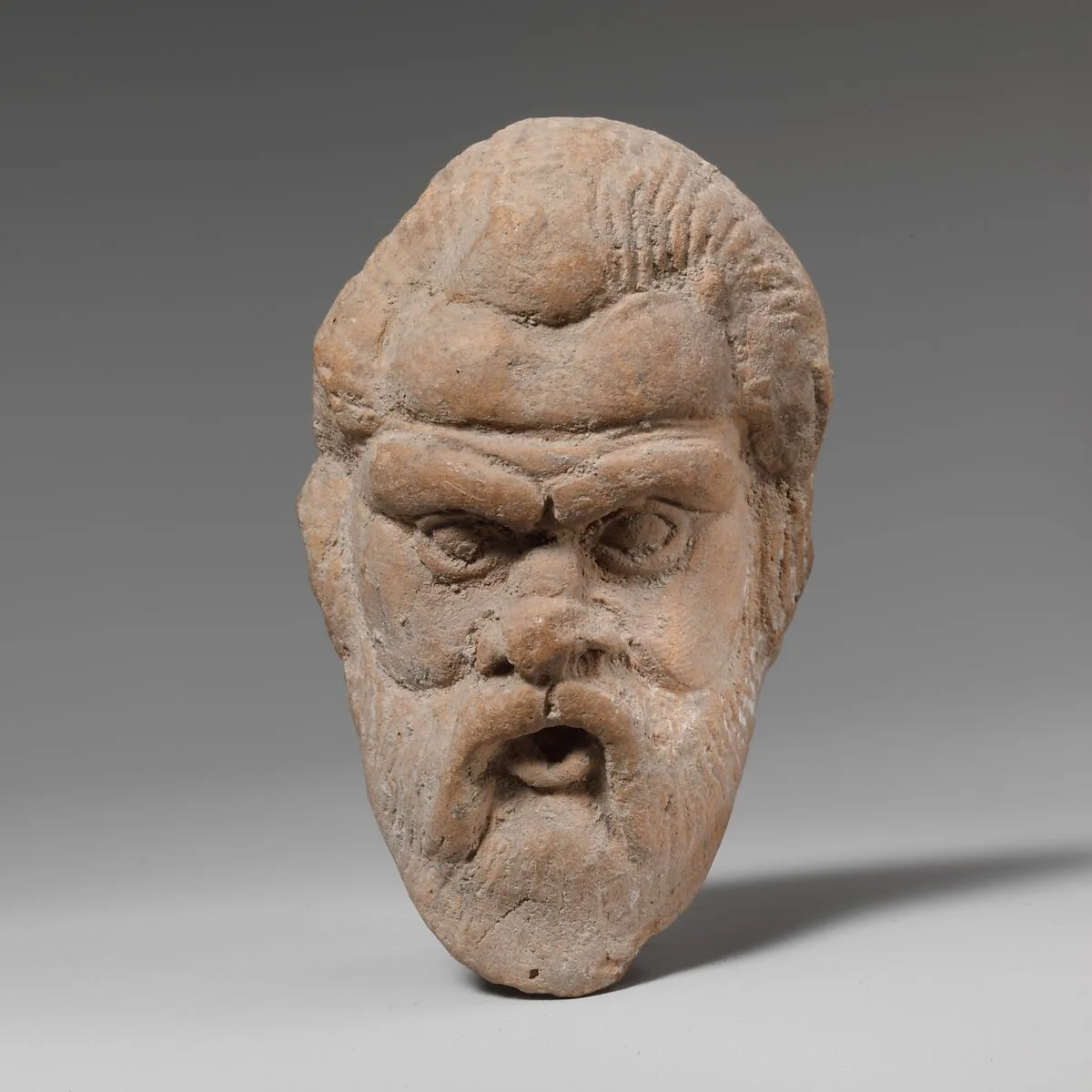 Terracotta head, possibly of a comic actor — Unknown