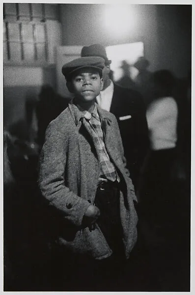 Boy in a cap at a dance, N.Y.C. — Diane Arbus