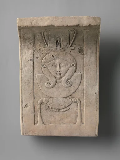 Relief plaque of Hathor emblem, curved as if from a temple frieze