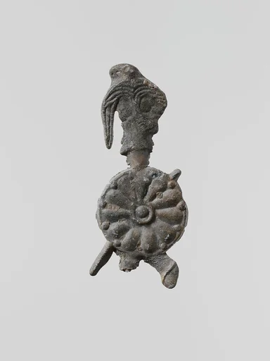 Lead figure of a warrior with a helmet, shield, and spear