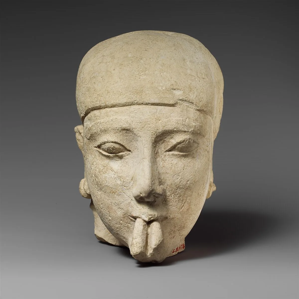 Limestone head of a male aulos player — Unknown