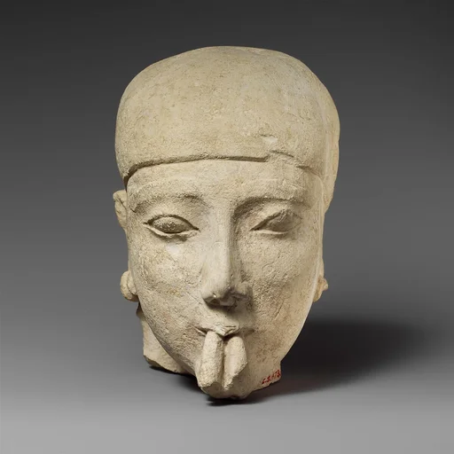 Limestone head of a male aulos player