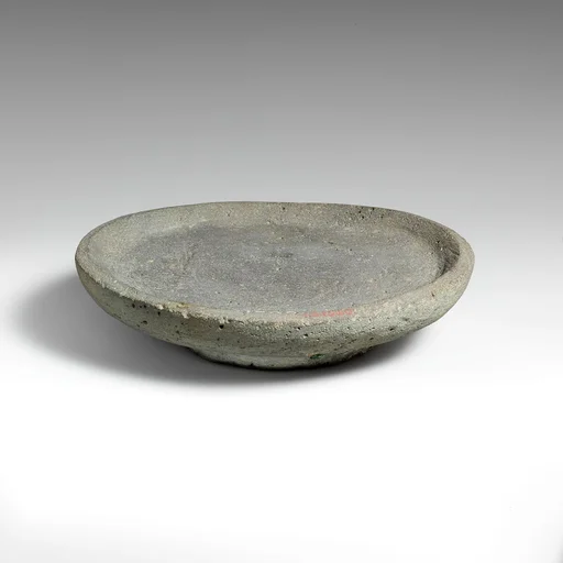 Vesicular basalt mortar or plate