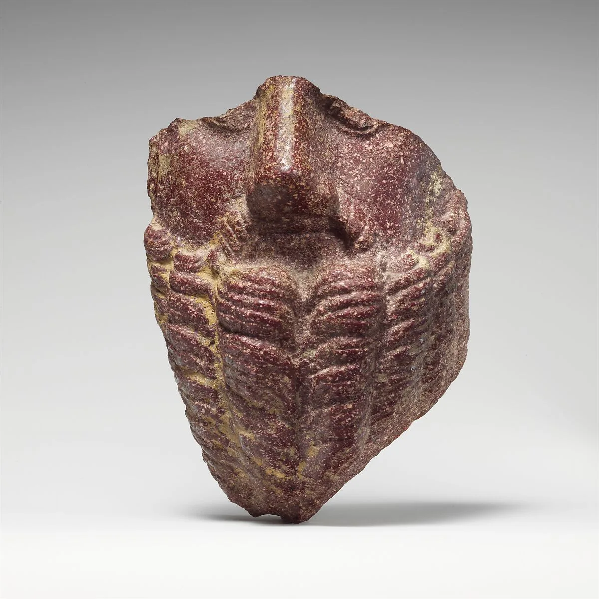 Fragmentary porphyry head of a bearded man — Unknown