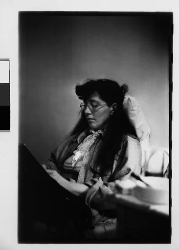 [Five 35mm Film Frames: Jane Smith Evans Reading Newspaper in Bed, New York City]