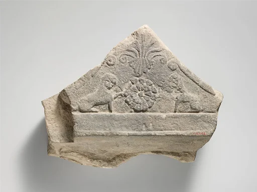 Limestone finial of a funerary stele