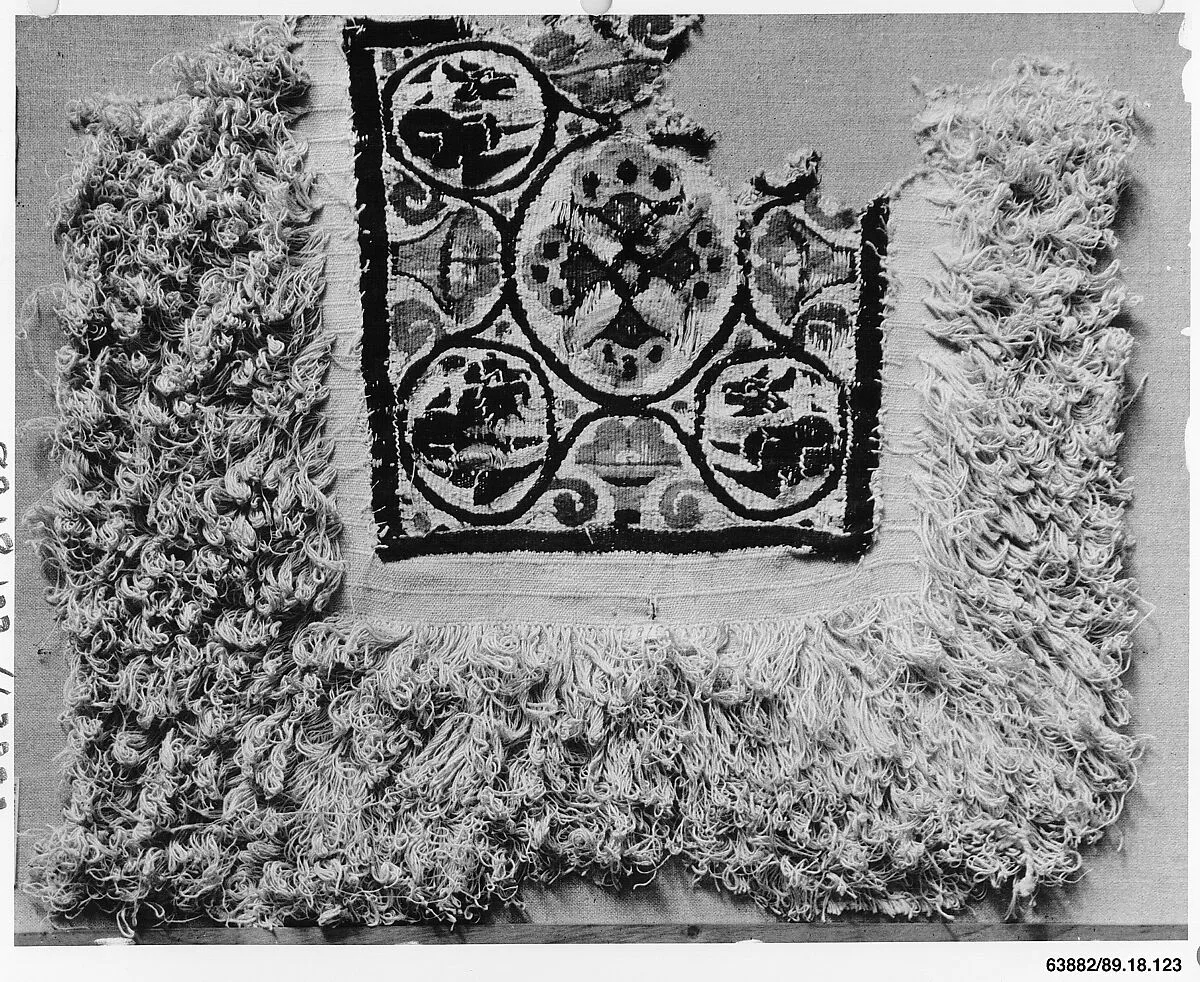 Fragment of a Cover or Blanket with Ornamental Square Featuring Flowers and Animals — Unknown
