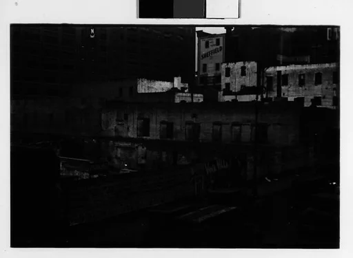 [Two 35mm Film Frames: Buildings and Bridge Lined with Movie Posters, Two Women in Berets on Street, New York City]