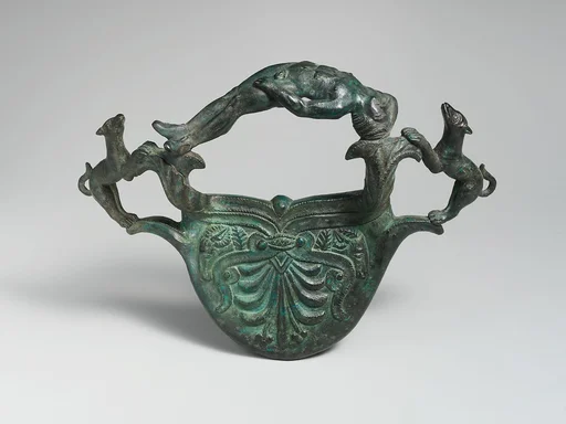 Bronze handle with dogs flanking a reclining youth