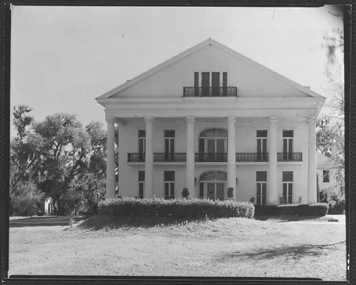 [Greek Revival House with Balcony in Full-Façade Gable]