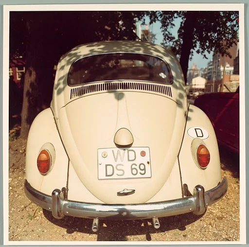 [Back of Volkswagen Beetle, England]