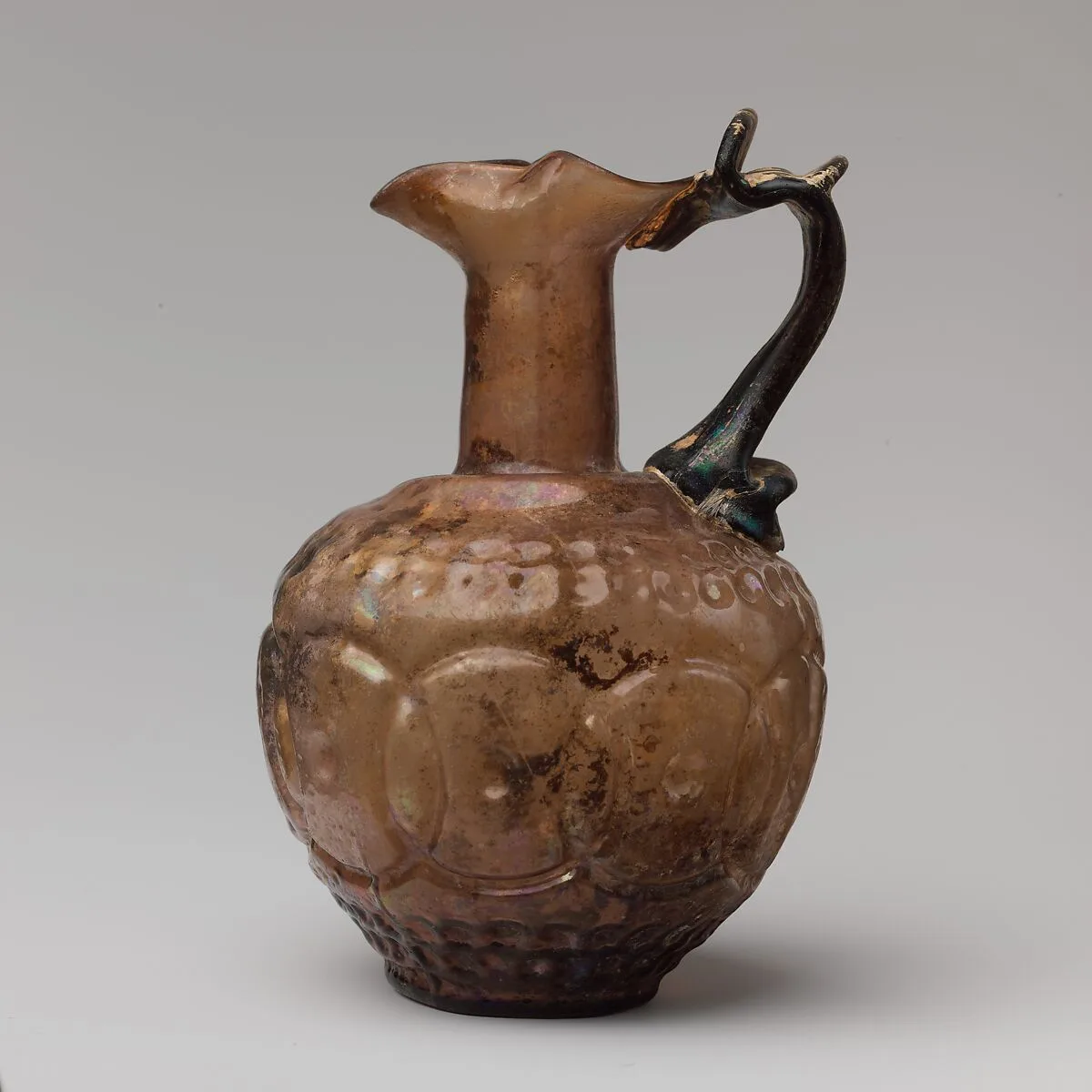Glass jug decorated with intersecting circles — Unknown