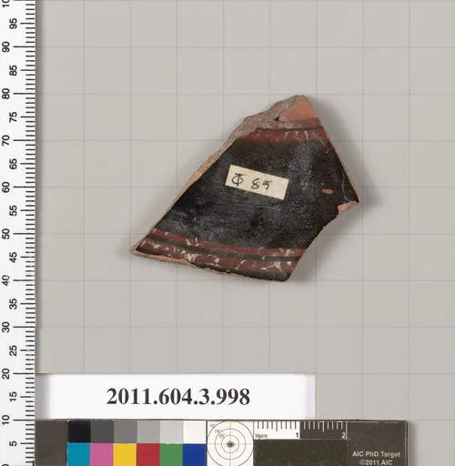 Terracotta fragment of a lekanis lid (covered dish)