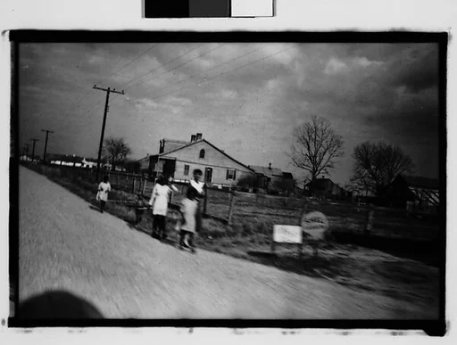 [Women and Girls Walking by Side of Road, From Moving Automobile, New Orleans Vicinity, Louisiana]
