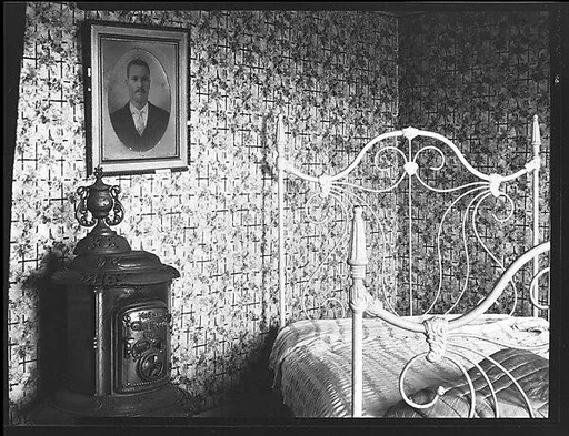 [Bedroom with Wood Stove in De Luze House, Truro, Massachusetts]