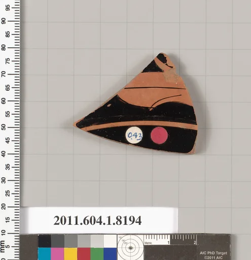 Terracotta fragment of a kylix (drinking cup)