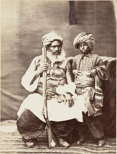 [Turbaned Man Holding Rifle with Boy Alongside]