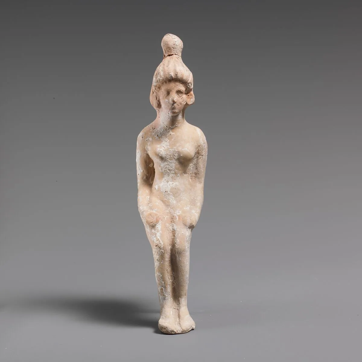 Terracotta statuette of a seated doll — Unknown