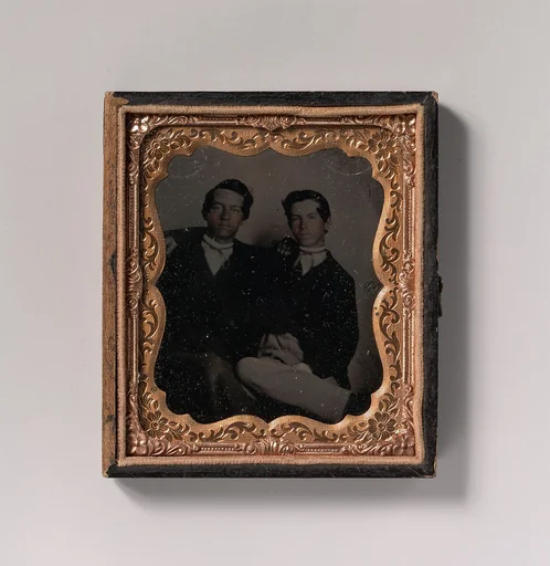 [Two Young Men Seated with Their Arms Around Each Other]