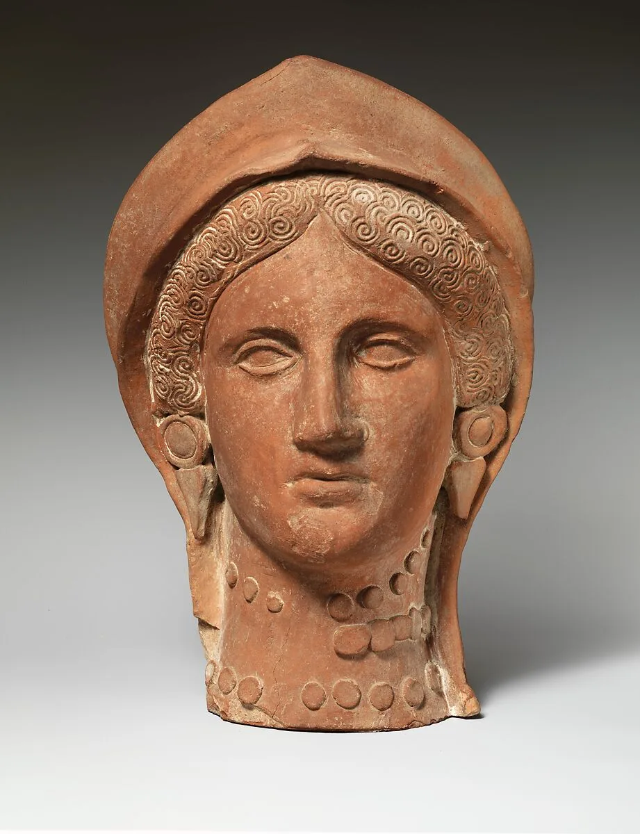 Terracotta head of a woman wearing a stephane — Unknown