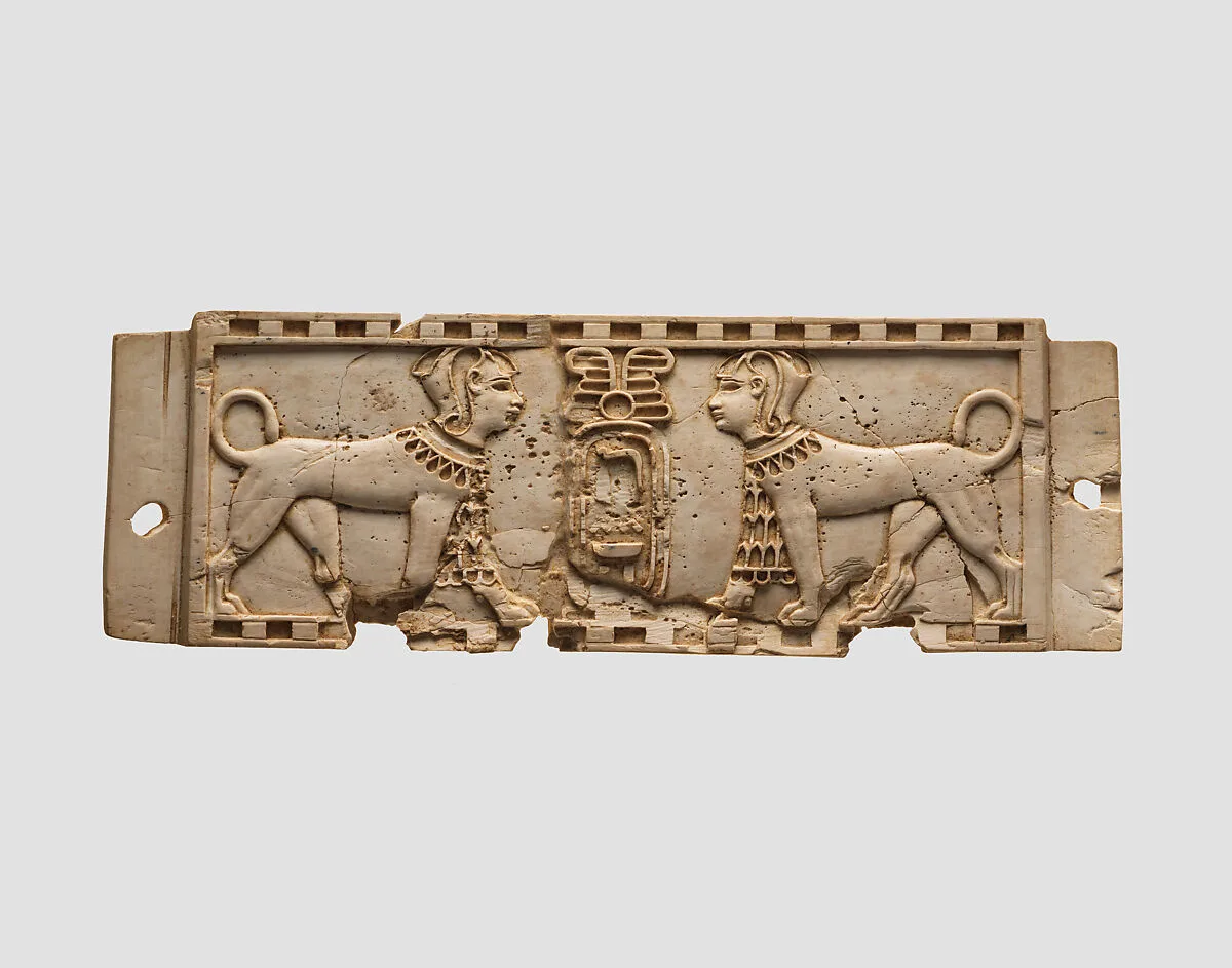 Cloisonné furniture plaque with two sphinxes flanking a cartouche — Unknown