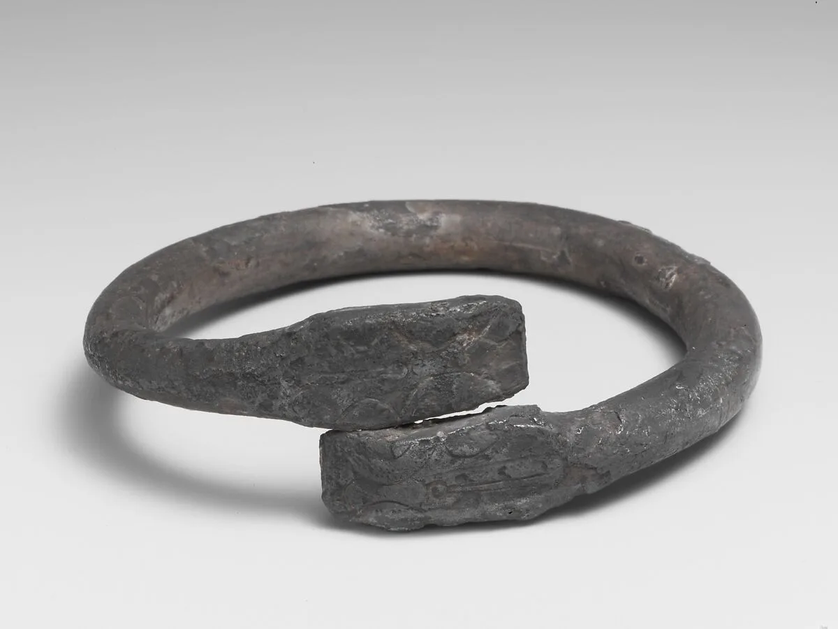 Silver bracelet ending in snake's heads — Unknown