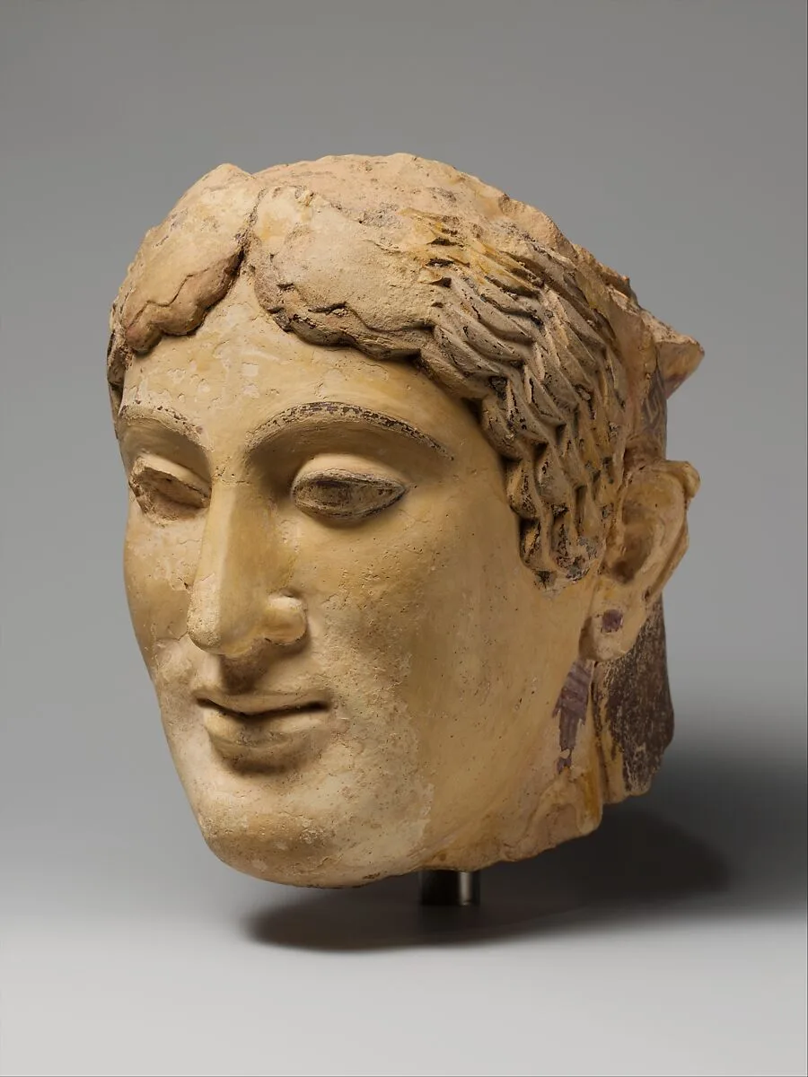 Terracotta head of a woman, probably a sphinx — Unknown