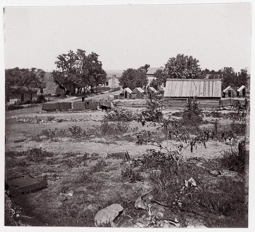 [View of a small town with wooden sheds in distance].  Brady album, p. 123