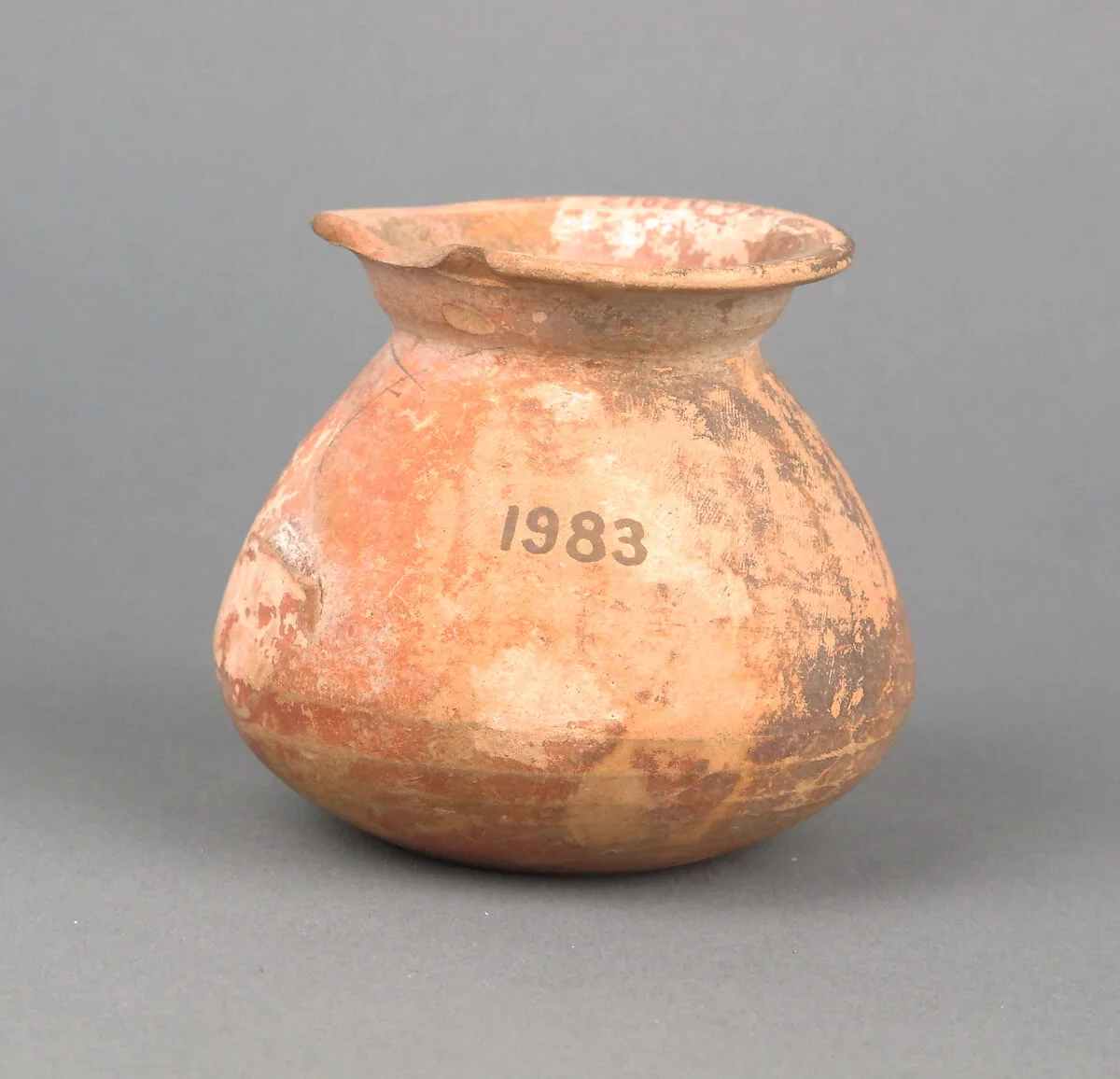 Terracotta juglet with incised letters on base — Unknown