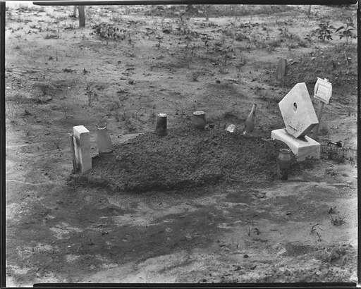 [Child's Grave with Bottles and Jars on Plot, Hale County, Alabama]