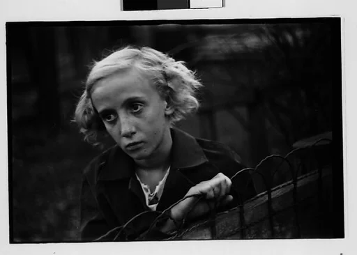 [Five 35mm Film Frames: Girl Leaning on Wire Fence in Yard, Vicinity Bethlehem, Pennsylvania]