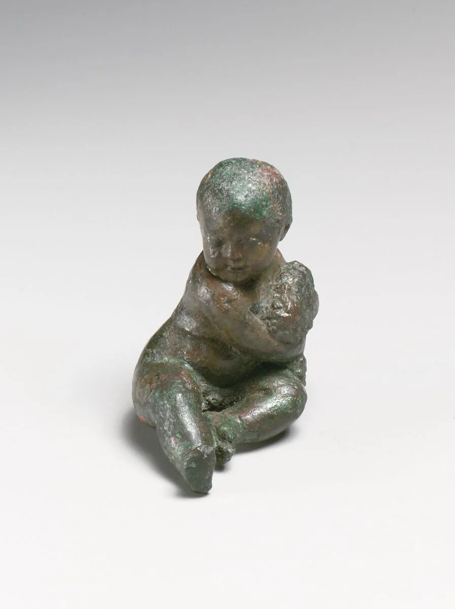 Bronze statuette of a child with a bunch of grapes — Unknown