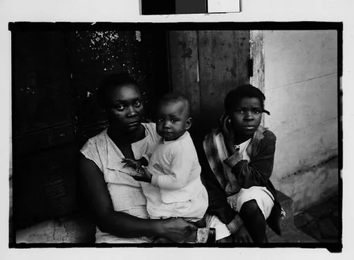 [Mother and Children Seated in French Quarter Doorway, New Orleans, Louisiana]