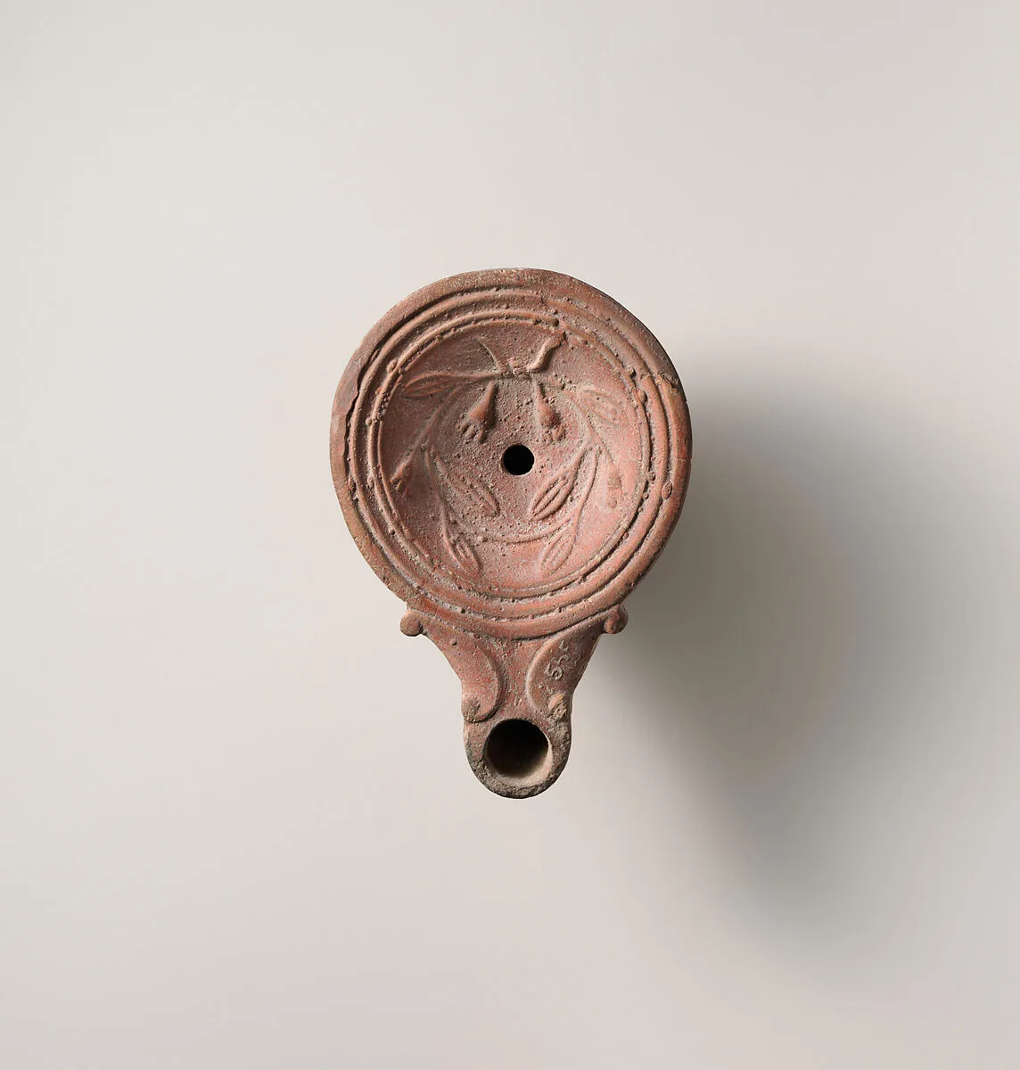 Terracotta oil lamp — Unknown