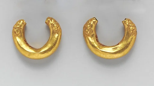 Gold boat-shaped earrings with lions' heads