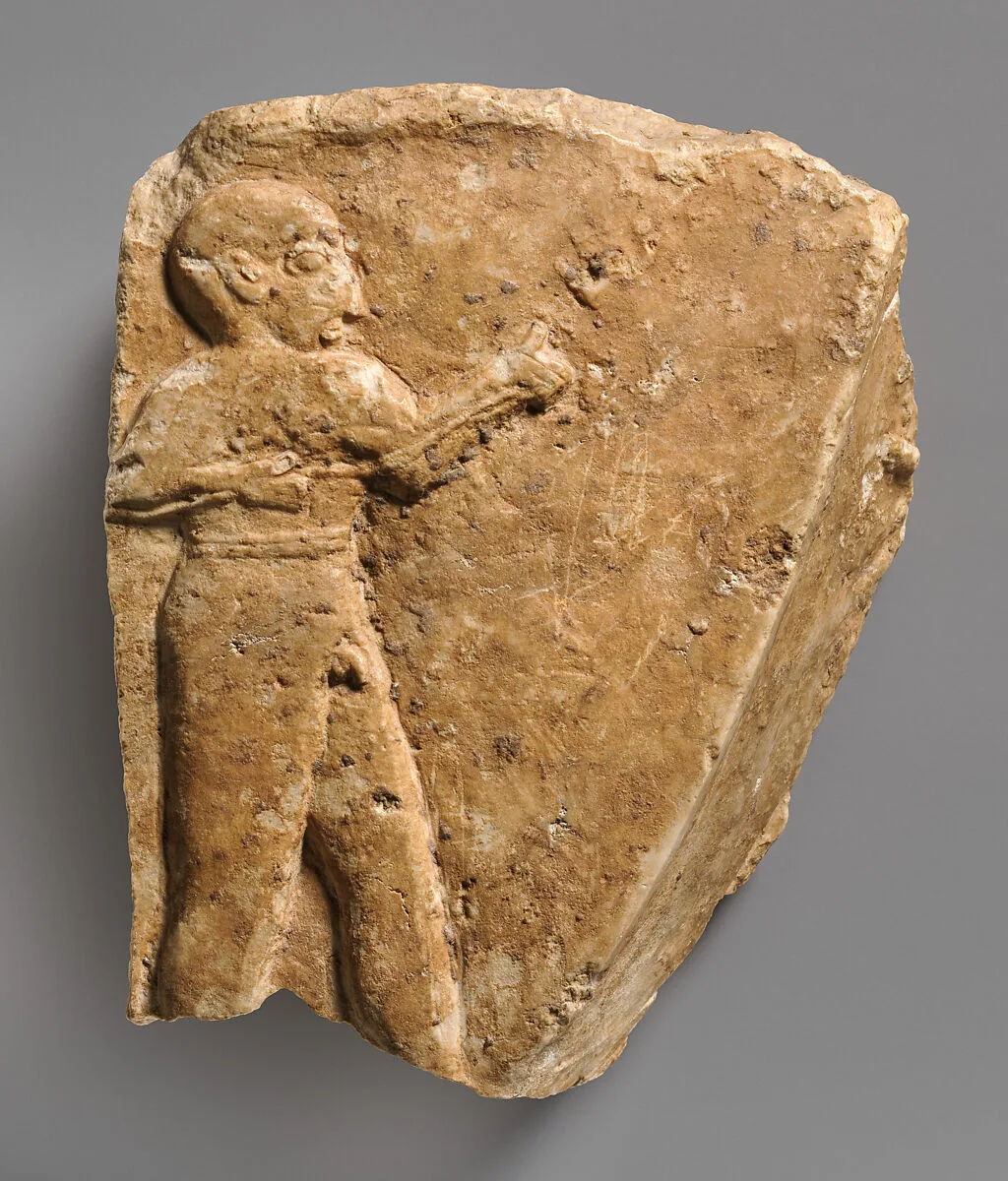 Fragment of a trough with a nude male figure in relief — Unknown