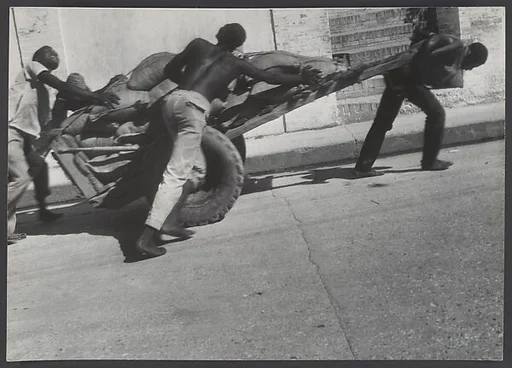 [Men Pulling Cart on Street, Haiti?]