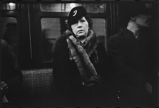 [Four 35mm Film Frames: Subway Passengers, New York City: Woman in Fur Collar, Woman with Package]