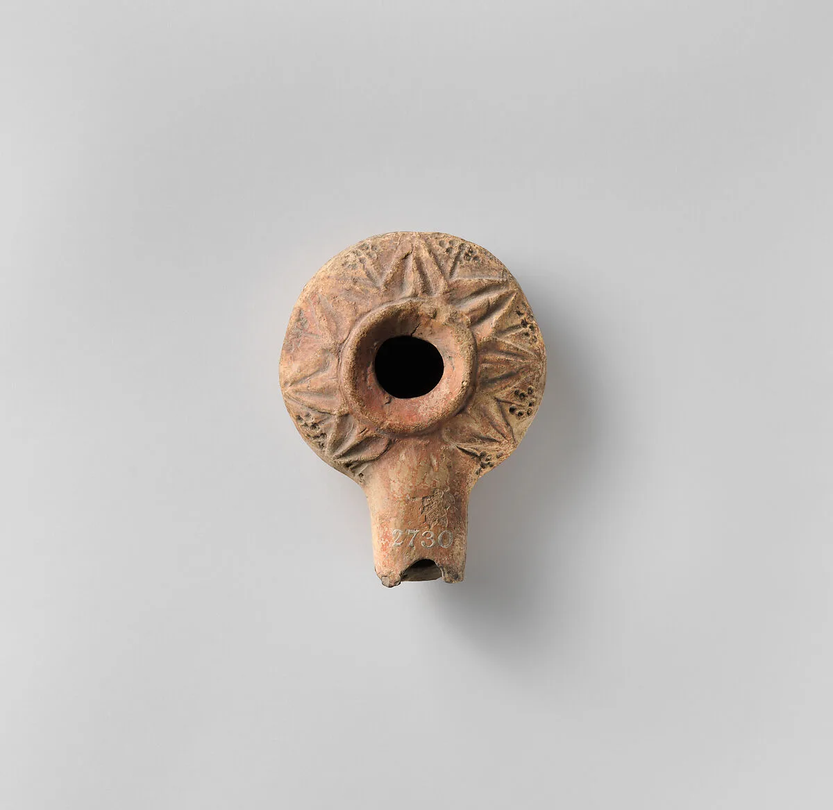Terracotta oil lamp — Unknown